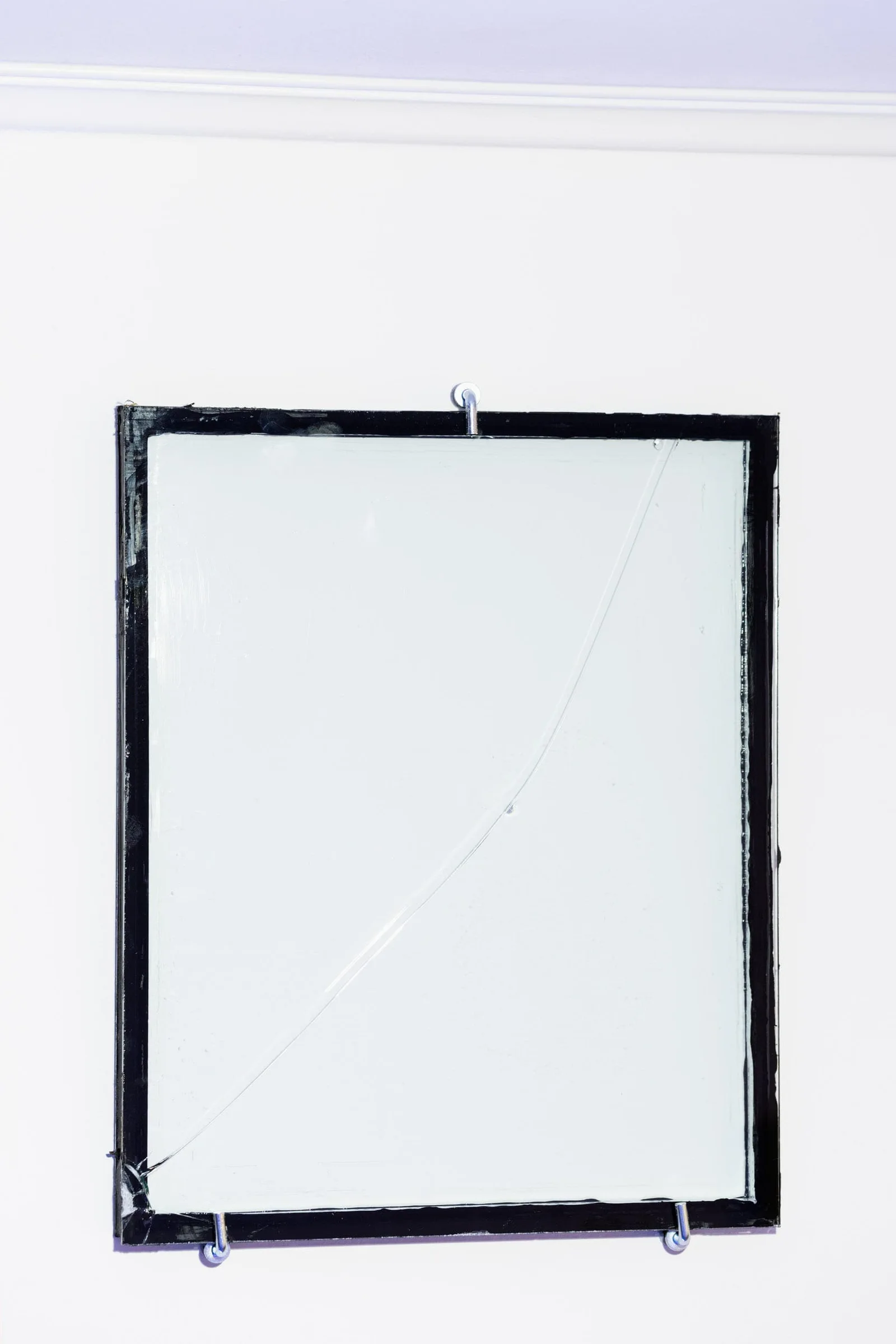 Michal Martychowiec, The incredulity of Saint Thomas IV: framed pane of glass with a fine crack