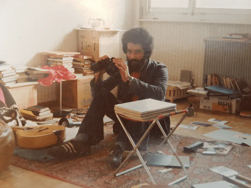 El Arbi Bouqdib in Brussels in 1978, sitting in a room full of books and papers
