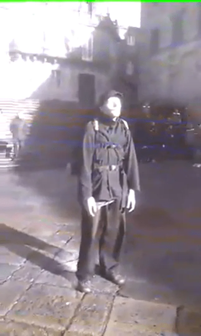 Old photograph of a man in front of a church building, heavily faded, photographer unknown