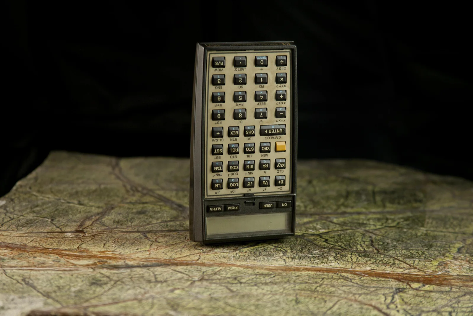 1-11 HP-41CX (1983 at the earliest): a pocket calculator standing on a map